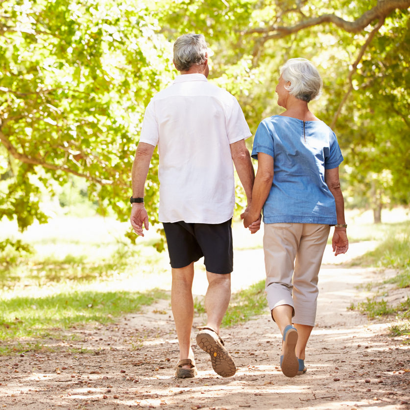 older couple walking on path
