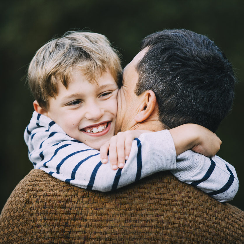 father and son embracing